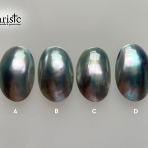 May include: Four iridescent oval-shaped pearls in shades of gray, green, and purple. The pearls are labeled A, B, C, and D.