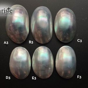 May include: Six iridescent oval-shaped stones labeled A3, B3, C3, D3, E3, and F3. The stones have a white, gray, and blue iridescent sheen.