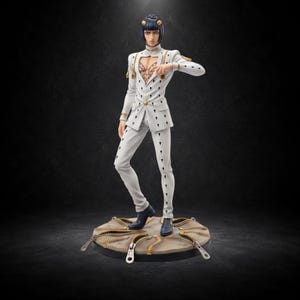May include: A collectible figurine of a character with dark hair, wearing a white suit featuring gold accents, a heart-shaped chest cutout, and black teardrop patterns. The figure stands on a circular base decorated with multiple gold zipper pulls.