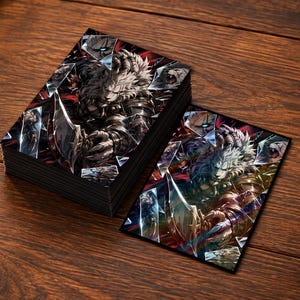 May include: A stack of rectangular trading card sleeves and one individual sleeve featuring a detailed illustration of a white-furred, armored warrior creature holding a blade, set against a dark background with shattered glass visual effects.
