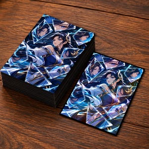 May include: A deck of rectangular trading cards and one single card featuring an anime-style character with long dark hair, wearing a blue and white outfit, surrounded by fragmented, glowing blue geometric shards and reflective glass-like shapes.