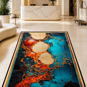 May include: A rectangular area rug featuring a vibrant abstract pattern of interconnected circular shapes and fluid lines in shades of deep blue, bright turquoise, fiery orange, and cream, finished with a solid black border trim.