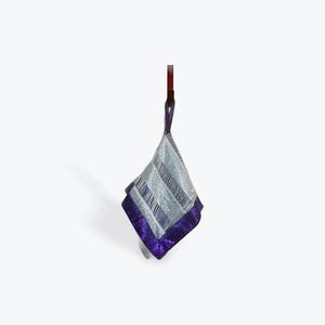 May include: A silver and purple patterned silk handkerchief with a purple border.