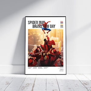 May include: A framed movie poster titled Spider Man Brand New Day featuring a central illustration of a red and blue superhero leaping above a group of figures in red cloaks wielding swords against a golden city backdrop with text and logos.