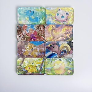 May include: A set of eight rectangular magnets featuring colorful illustrations of various animated creatures. Each magnet displays a distinct character in a unique setting, including a blue creature, a pink round figure, a boxing character, and a yellow duck.