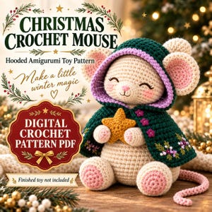 May include: A digital crochet pattern PDF for a Christmas crochet mouse. The mouse is cream-coloured with pink inner ears and feet, wearing a dark green hooded cloak with purple trim and floral embroidery, holding a small yellow star.