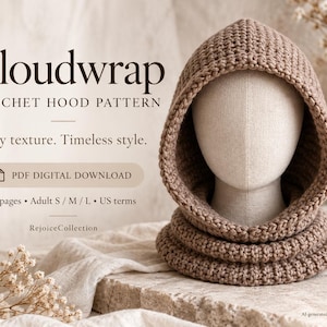 May include: A light brown crochet hood pattern titled Cloudwrap. The text includes PDF DIGITAL DOWNLOAD, 24 pages, Adult S / M / L, and US terms. The hood is displayed on a mannequin head, featuring a thick, textured knit construction.