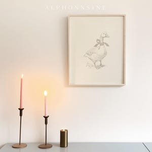 Sweet gosling wall decor for a nursery — carefully crafted line art featuring a large bow, connecting nature and minimalism.