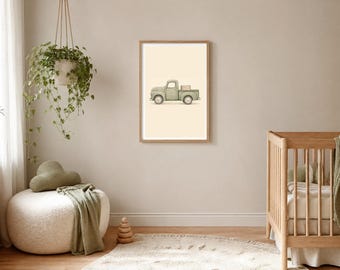 May include: A framed wall art print featuring a light sage green vintage pickup truck illustration centered on a cream-colored background. The truck is depicted in profile, facing left, with a small rectangular cargo box in the truck bed.
