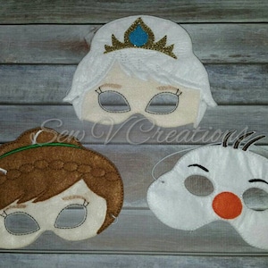 May include: Three felt face masks, one white with a gold crown, one brown with a green headband, and one white with a red nose and black eyes.