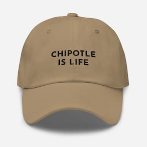 May include: A tan baseball cap with black embroidered text that reads "Chipotle is Life".