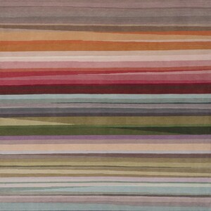 May include: A rectangular area rug featuring a series of horizontal stripes in varying widths and colors, including shades of muted red, orange, pink, olive green, light blue, grey, and beige, creating a layered, multi-toned linear pattern.