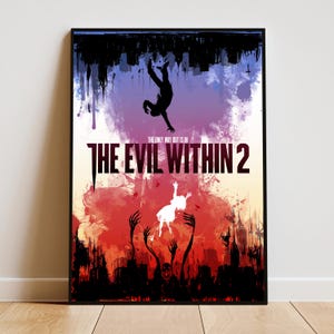 May include: A framed poster featuring a dark silhouette of a person falling from a black cityscape at the top and a white silhouette of a person rising from a red, fiery landscape at the bottom, with the text THE EVIL WITHIN 2 in the center.