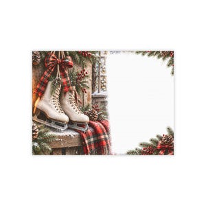 May include: A stationery sheet featuring a festive holiday border with a pair of white ice skates hanging from a wooden post, adorned with a red and green plaid ribbon, pine branches, pinecones, red berries, and a matching plaid fabric accent.