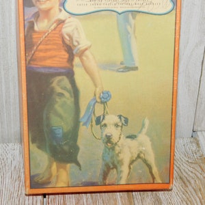 May include: A vintage illustration of a young boy in a red and white striped vest and blue pants walking a small white dog with a blue ribbon around its neck. The boy is holding the ribbon in his hand and the dog is looking up at him. The background is a light yellow color.
