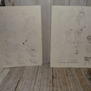 May include: Two vintage sheets of paper with pencil sketches of cartoon characters. One sheet features dog drawings, the other has various cartoon figures. The text "CONSTRUCTION OF SOME OTHER CHARACTERS" is visible.