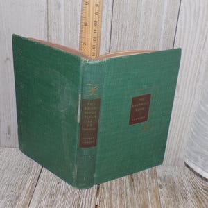 May include: A green hardcover book titled "The Enjoyment of Books" by  A.  C.  Coolidge. The book is in good condition with no visible damage.