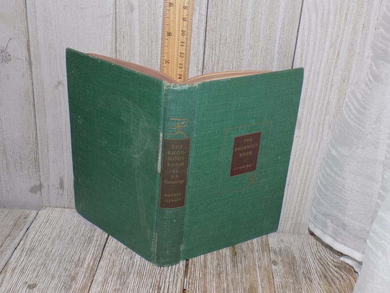 May include: A green hardcover book titled "The Enjoyment of Books" by  A.  C.  Coolidge. The book is in good condition with no visible damage.