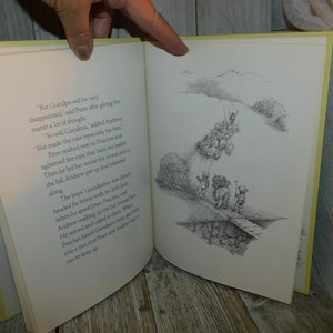 May include: A black and white illustration of a group of children walking along a path. The children are carrying a large cake and a rope. The text in the image reads, "But Grandpa will be very disappointed," said Peter after giving the matter a lot of thought. "So will Grandma," added Andrew. She made the cake especially for him. Peter walked over to Peaches and tightened the rope that held the basket. Then he led her across the ravine and up the hill. Andrew got up and followed along. The boys' Grandfather was already headed for home with his little flock when he spied Peter, Peaches, and Andrew walking up the hill toward him. He waved and called to them. When Peaches heard Grandpa's voice, she broke into a trot, and Peter and Andrew had to run to keep up."