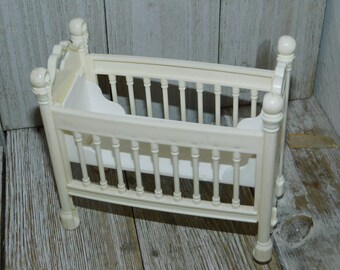 plastic doll crib