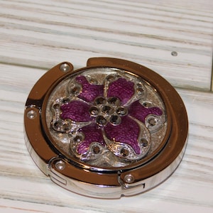 May include: A set of three ceramic mugs with a speckled, matte finish. The mugs are in shades of cream, light gray, and dark gray. Each mug has a simple, minimalist design, perfect for coffee or tea.