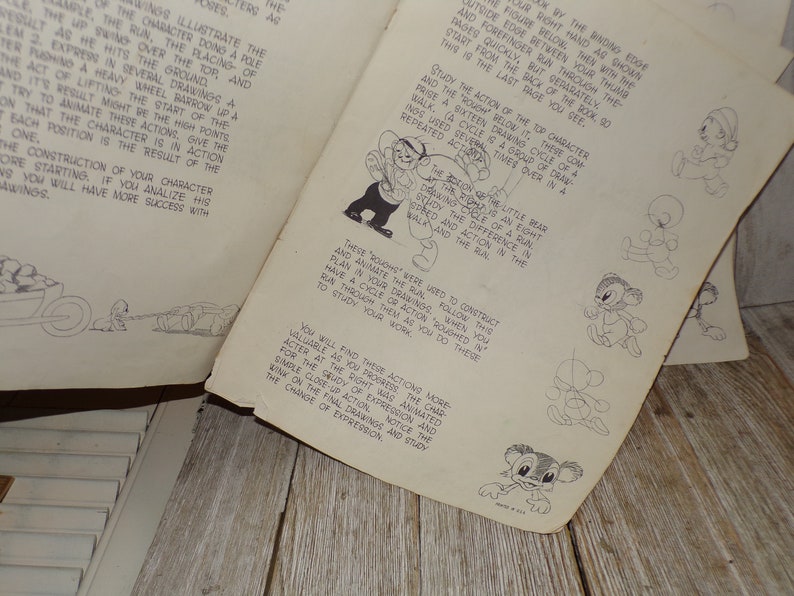 May include: Vintage animation guide with detailed illustrations and text. The pages show sequential drawings of cartoon characters in motion, including walking and running cycles. The guide is designed to teach animation techniques.