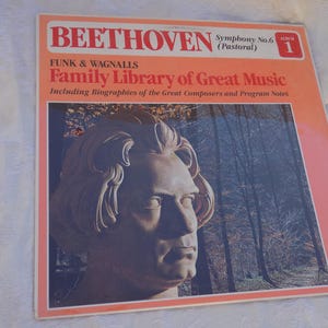 May include: A square vinyl record jacket featuring a bust of Beethoven against a forest background. The text reads BEETHOVEN Symphony No. 6 (Pastoral) Album 1, FUNK & WAGNALLS Family Library of Great Music, Including Biographies of the Great Composers and Program Notes, and RCA Custom STEREO.