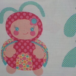 May include: A pink and yellow ladybug with a blue flower on its head. The ladybug has a polka dot pattern and is smiling. The image includes the text "left antenna" twice.