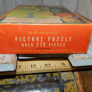 May include: A red box with the text "Masterpiece Picture Puzzle Over 275 Pieces Interlocking No. 3964 Made in U.S.A. Whitman Publishing Co."