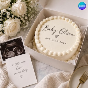 May include: A round white frosted cake in a box with the text Baby Olson, a heart icon, and ARRIVING 202X. Beside it is a sonogram image and a card with the text A little more love in our story and a heart icon, near white roses.