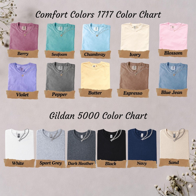 May include: A color chart displaying Comfort Colors 1717 and Gildan 5000 t-shirts. The Comfort Colors section shows shirts in berry, seafoam, chambray, ivory, blossom, violet, pepper, butter, espresso, and blue jean. The Gildan section shows white, sport grey, dark heather, black, navy, and sand shirts.