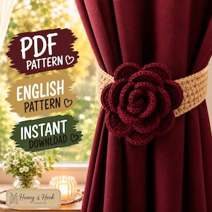 May include: A crochet curtain tieback featuring a large, dark red rose attached to a beige band. The image includes text: PDF PATTERN, ENGLISH PATTERN, INSTANT DOWNLOAD, and Honey & Hook STUDIO. The tieback is wrapped around a dark red curtain.
