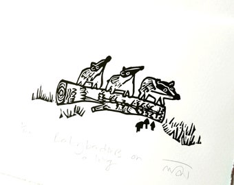 Baby Badgers on a Log - lino cut print