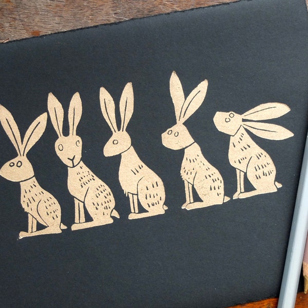 Line of Gold Hares - lino cut print