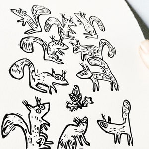 Ten Squirrels and an Acorn - lino cut print