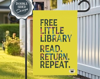 May include: A yellow garden flag featuring the text "FREE LITTLE LIBRARY READ. RETURN. REPEAT." in dark, patterned letters. A circular badge in the top left corner reads "DOUBLE SIDED Design" and a small logo is visible in the bottom right corner.
