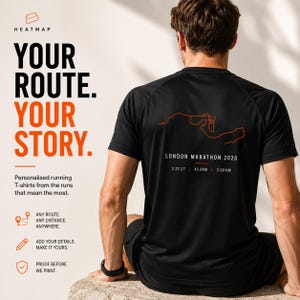 May include: A black short-sleeved t-shirt featuring an orange line-art map of the London Marathon 2026 route on the back. Below the map, the text reads LONDON MARATHON 2026, 2:27:27, 42.2KM, and 3:28/KM in white, sans-serif lettering.