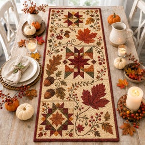 May include: A rectangular quilted table runner featuring a cream background with a repeating pattern of autumn leaves, acorns, berries, and geometric star blocks in shades of orange, red, brown, and green, finished with a dark red border.