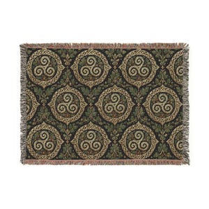 May include: A rectangular woven throw blanket featuring a repeating pattern of gold triskele symbols enclosed in circular frames. The design is set against a black background with green oak leaves and acorns filling the spaces between the circles.