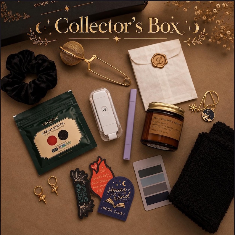 May include: A collector's box set containing a black scrunchie, a gold-tone tea infuser, a white paper envelope with a wax seal, a Vahdam Assam Exotic tea pouch, a white portable light, a purple marker, a candle, a bookmark, and stickers.