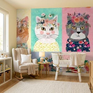 May include: A wall mural featuring three panels of cats wearing floral crowns. The left panel shows an orange cat, the center panel a white cat with a yellow polka dot shirt, and the right panel a gray cat with a dark floral shirt.