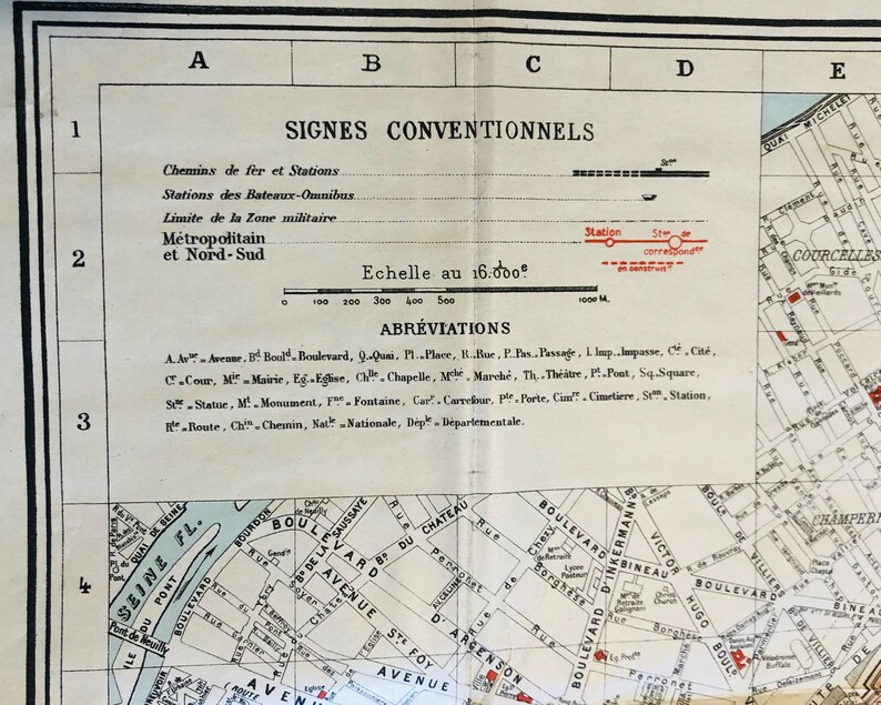 May include: A black and white map of Paris, France, with a scale of 1:16,000. The map shows the Seine River, the Eiffel Tower, and other landmarks. The map also includes a key with symbols for different types of transportation, buildings, and other features.