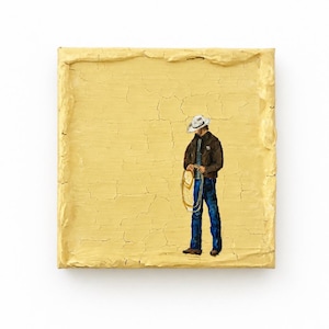 May include: A square painting on a textured, cracked yellow background featuring a figure wearing a white cowboy hat, a dark brown jacket, and blue jeans. The figure holds a coiled rope in their hands while standing against the solid yellow field.