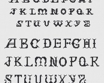 May include: Black, pixelated alphabet letters in a serif font are displayed on a light gray background. The letters are arranged in rows, with the uppercase letters at the top and the lowercase letters below. The letters are in a vintage style.