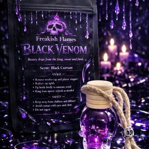 May include: A black pouch labeled Freakish Flames Black Venom with text detailing usage and safety, alongside a clear glass skull-shaped bottle filled with purple liquid, featuring a wooden cap and a thick rope hanger with a small skull bead.