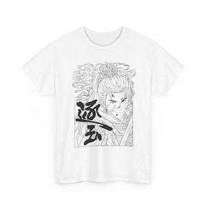 May include: A white short-sleeve t-shirt featuring a black and white line art graphic of a warrior with a high ponytail and ornate headpiece. The design includes stylized smoke, a sword, and bold Chinese characters on the left side.