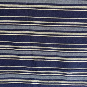 May include: Blue and white striped fabric with a woven texture.
