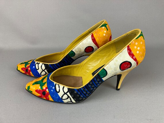 Premium AI Image | A yellow high heel shoe with flowers on it.