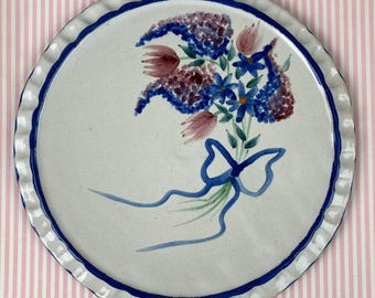 Vintage Trivet, Ceramic, Studio Pottery, Bouquet of Flowers Tied with a Bow, Cobalt Blue Trim, Pinched Edges, 9" Diameter, Signed
