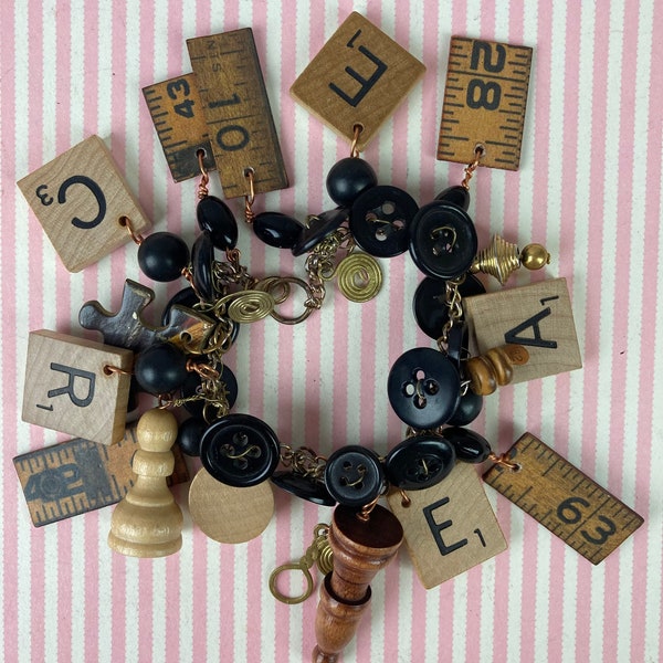 Vintage Bracelet, With Charms, Scrabble Tiles, Ruler Bits, Buttons,Game Pieces, Jig Saw Piece. 7 1/2" long, Gold Tone Chain